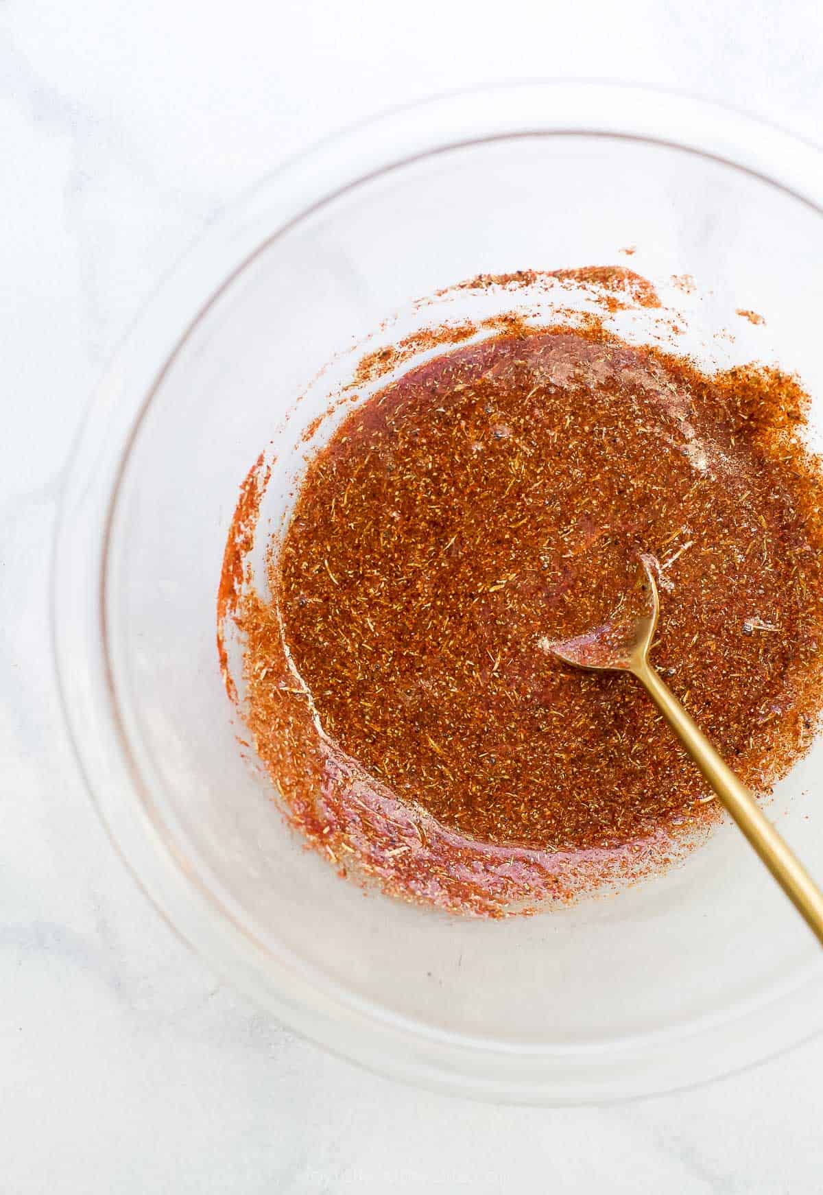maple spice rub in a bowl with a spoon