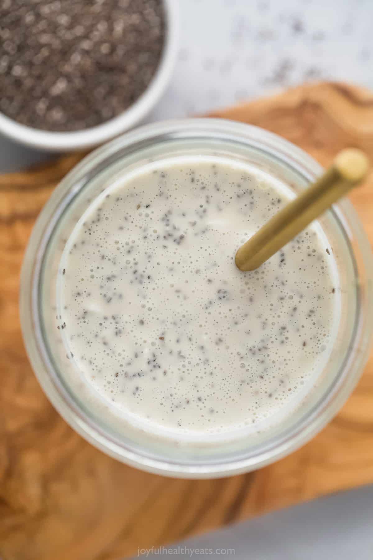 The combined ingredients for chia pudding in a jar before the pudding has set