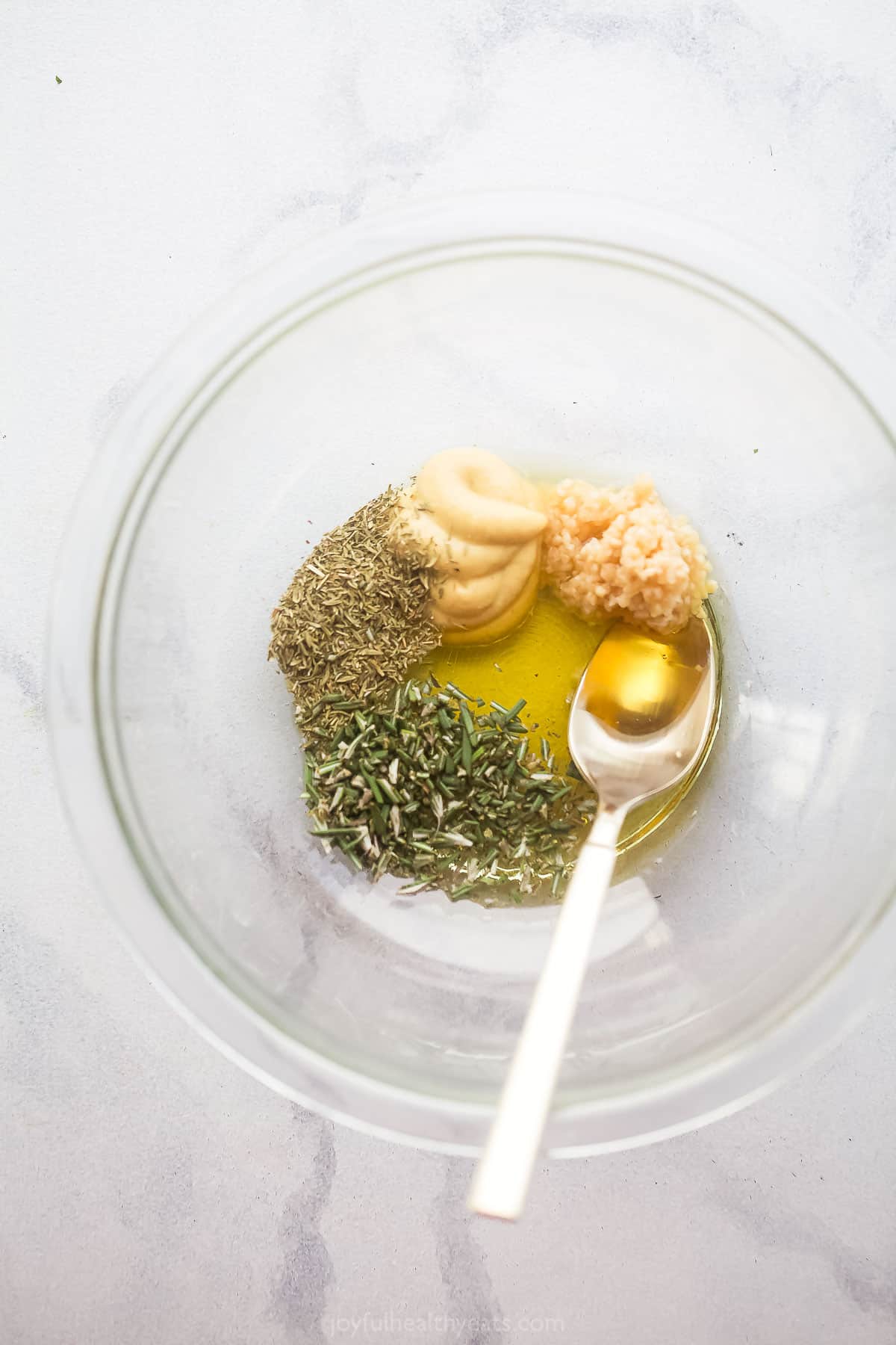 Honey garlic sauce ingredients in a glass bowl.