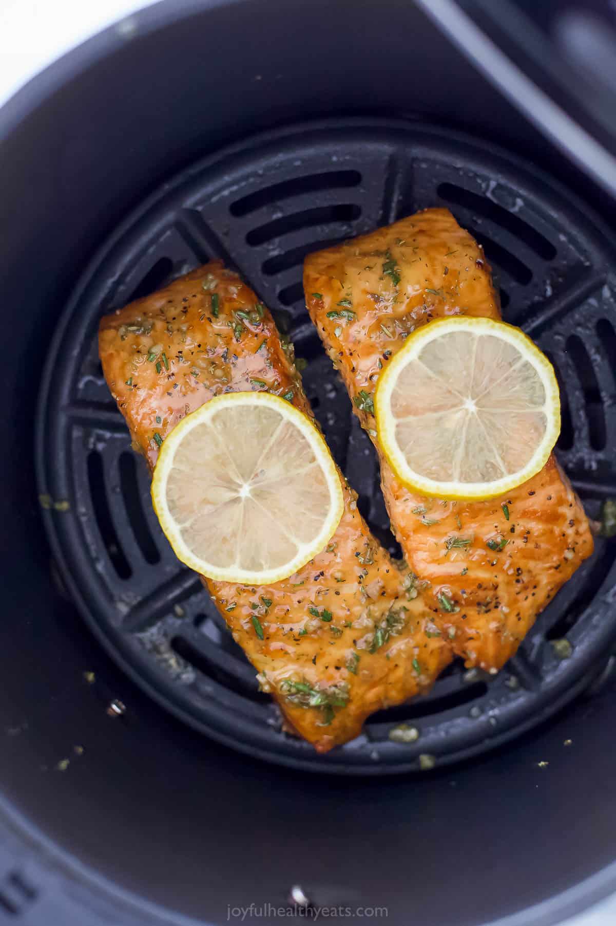 Two salmon fillets in the air fryer.