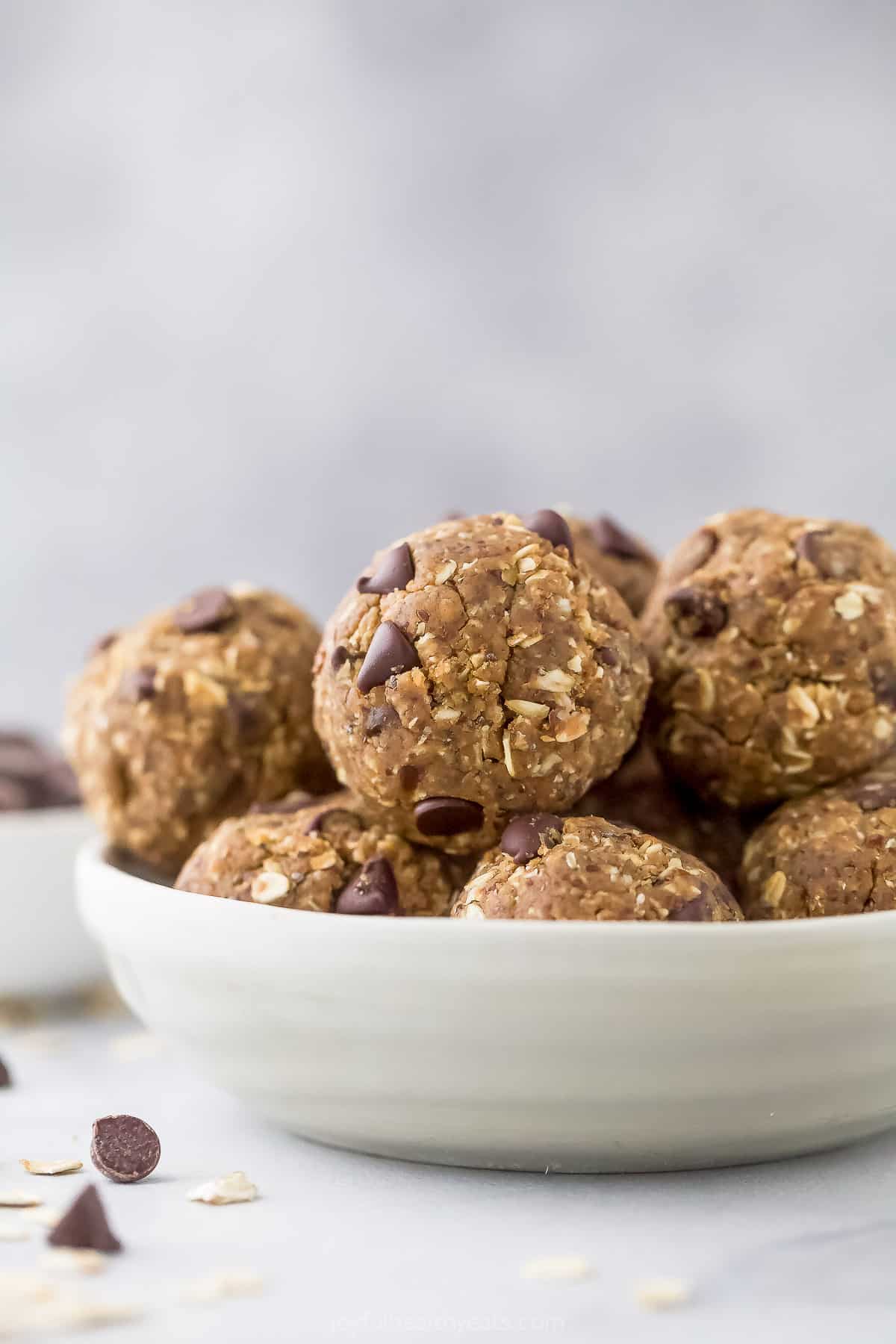 A close-up shot of a bowl filled with chocolate peanut butter energy bites