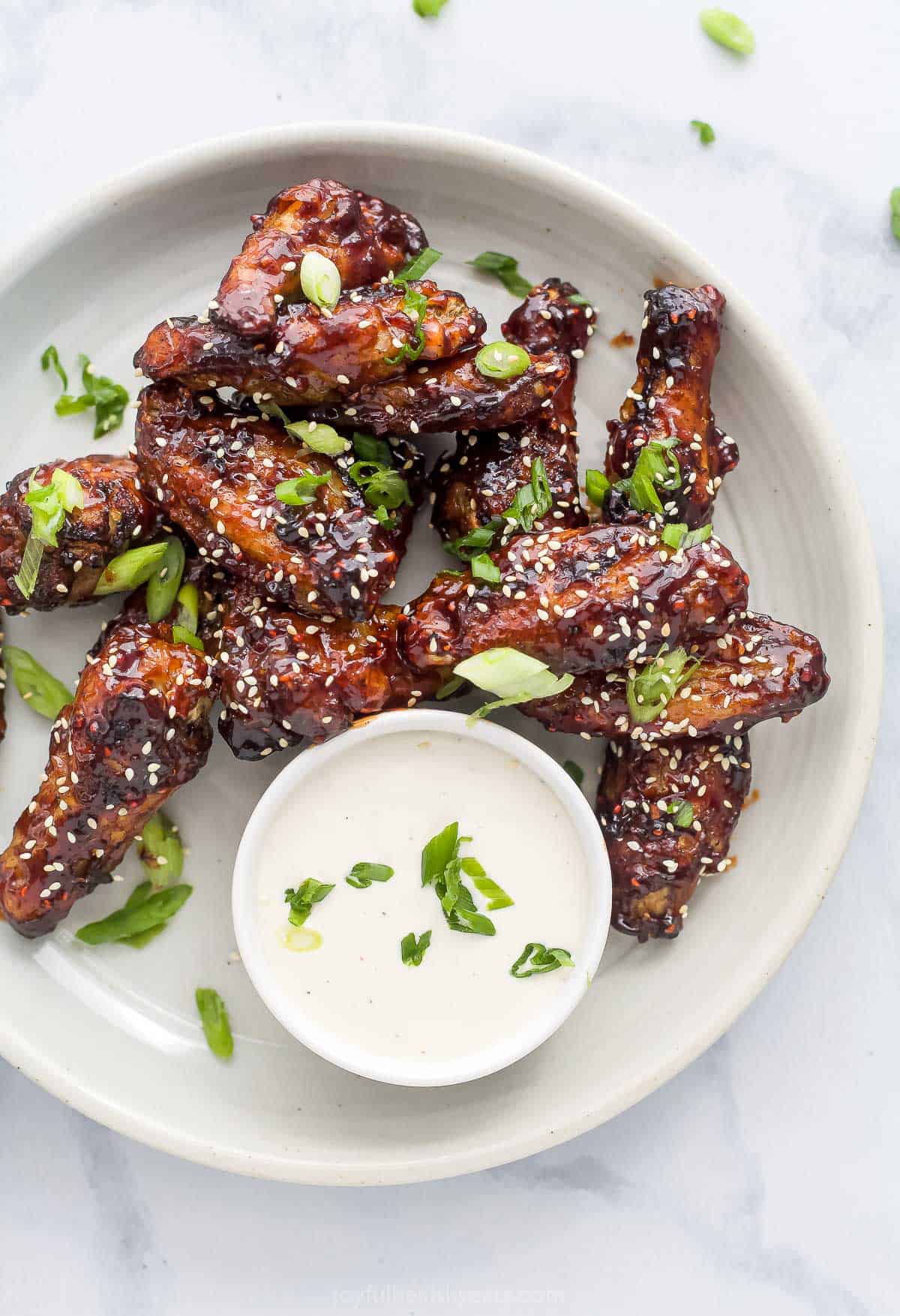 baked chicken wings with raspberry hoisin glaze on a plate