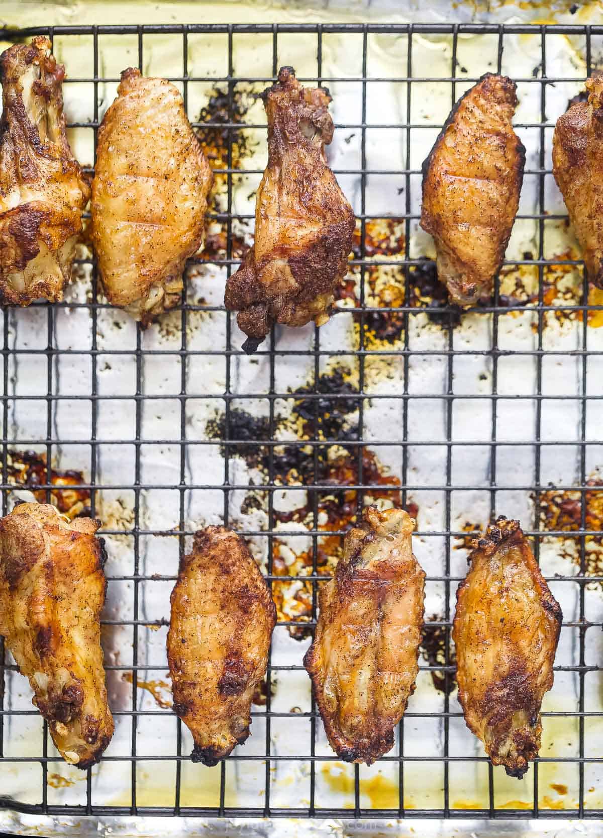 baked asian chicken wings on a baking sheet