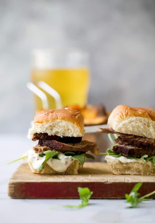 beer braised brisket sliders on a cutting board