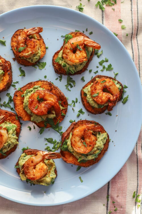 cajun shrimp guacamole bites on a sweet potato toasts