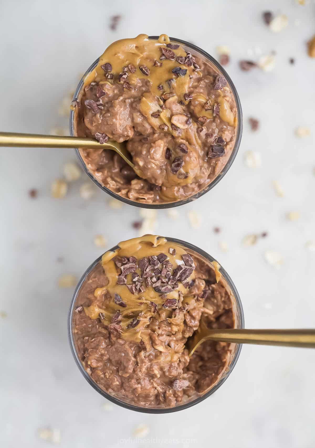 Overhead view of two dishes of chocolate peanut butter overnight oats