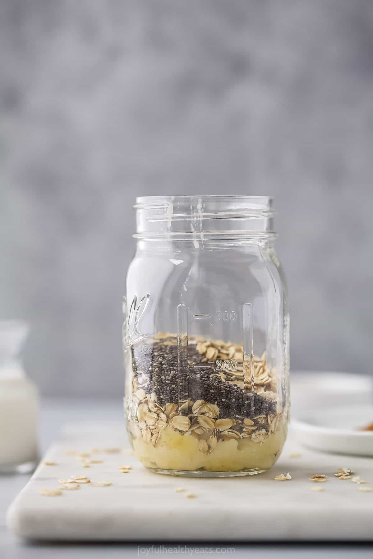 Mashed banana, oats, and chia seeds in a mason jar