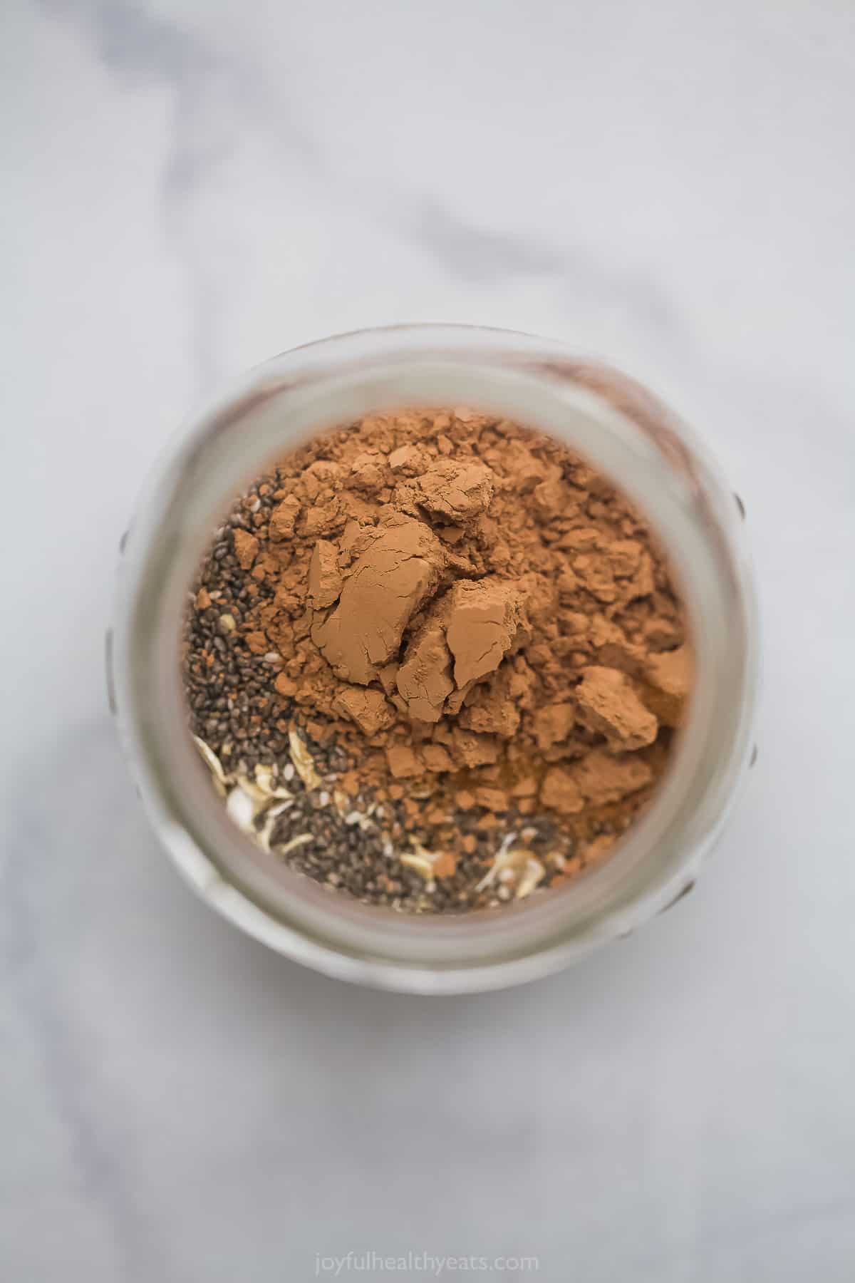 Overhead view of cocoa powder in a mason jar