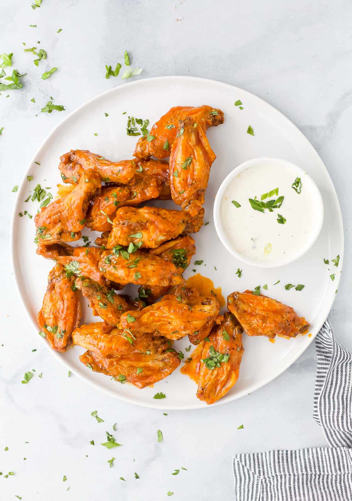 Air Fryer Chicken Wings with Primal Kitchen Buffalo Sauce 