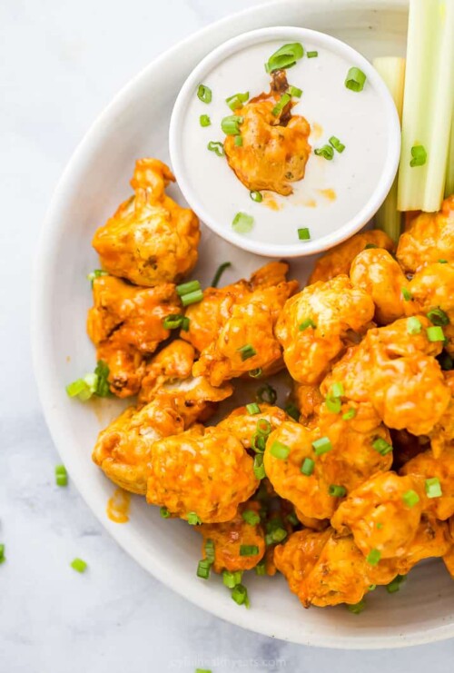 buffalo air fryer cauliflower wings on a plate with ranch