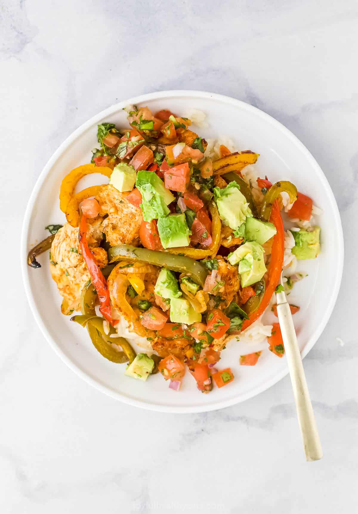 Overhead view of a chicken fajita bowl