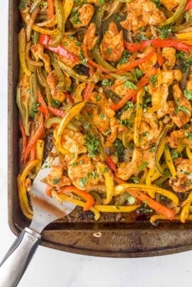 Close-up of sheet pan chicken fajitas on a baking sheet