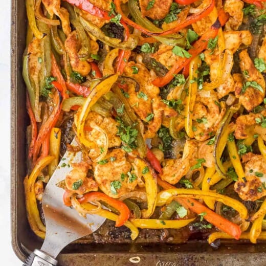 Close-up of sheet pan chicken fajitas on a baking sheet