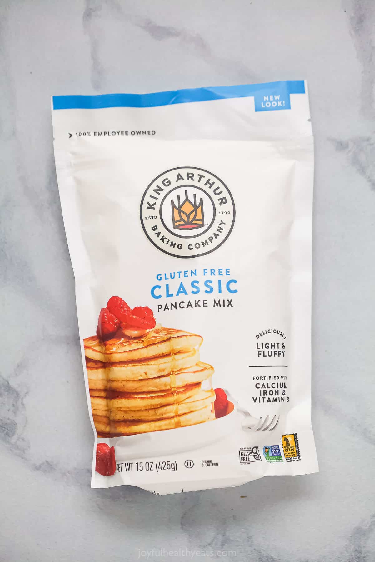 A bag of gluten-free King Arthur pancake mix on a marble countertop