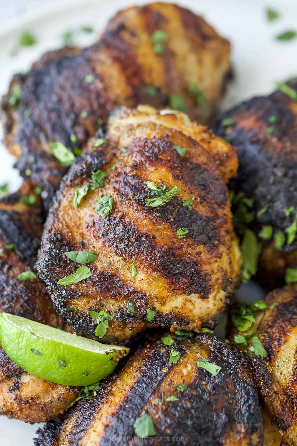 close up of grilled chicken thighs