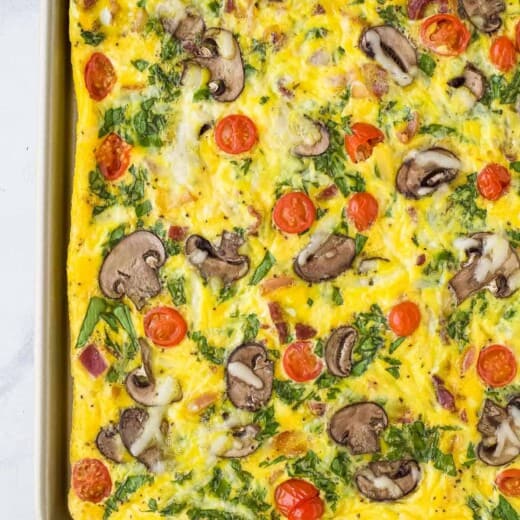A close-up shot of a mushroom and spinach breakfast frittata