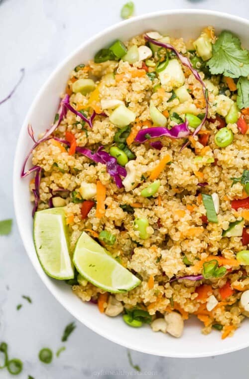 A bowl full of crunchy quinoa salad on top of a kitchen countertop