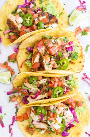 Four white fish tacos with cabbage slaw, avocado mash and chipotle lime crema