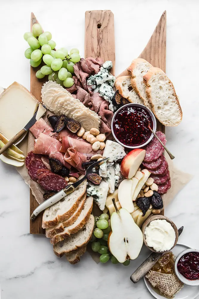 A presidential cheese board filled with meats, cheeses, and favorite snacks.