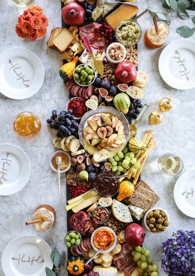 Top view of a crostini bar filled with charcuterie items.