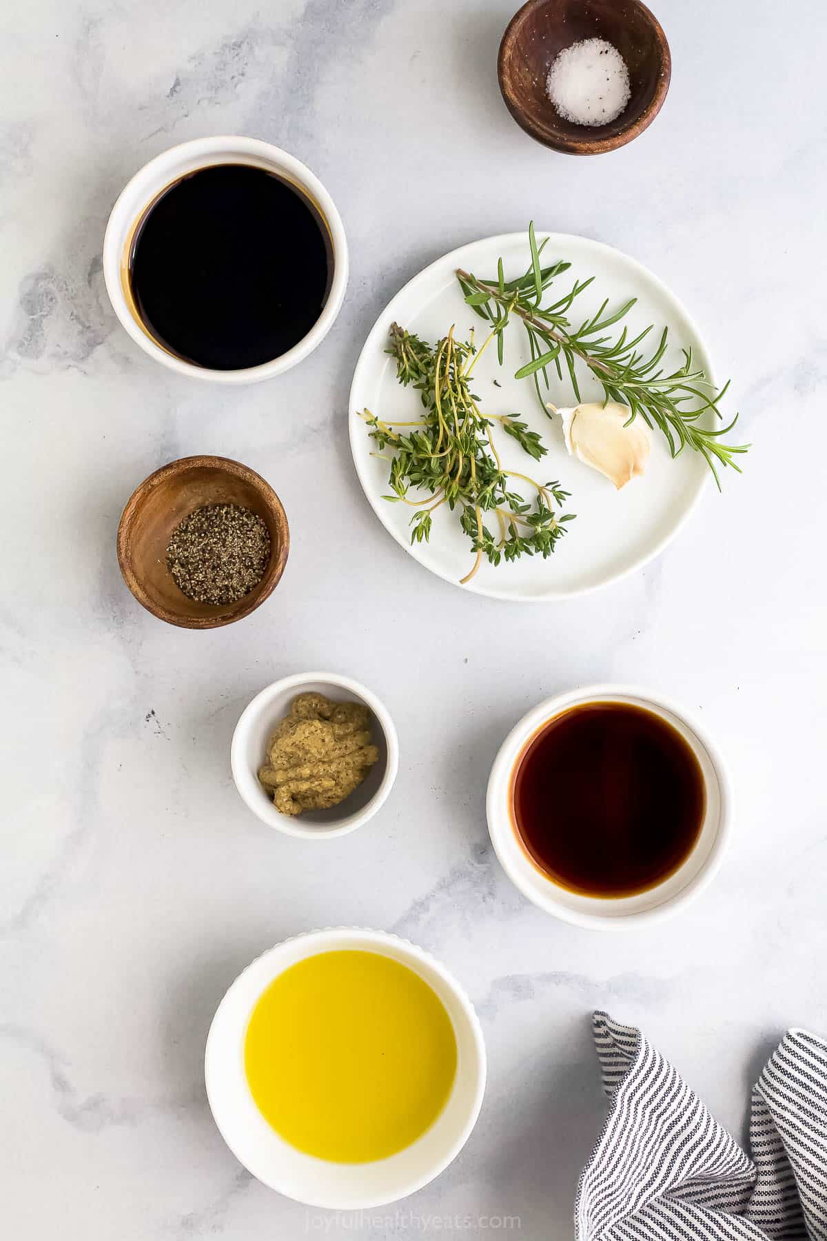 All of the ingredients for the best steak marinade arranged on a kitchen countertop