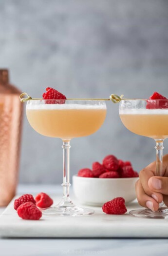 an easy French martini with raspberry garnish
