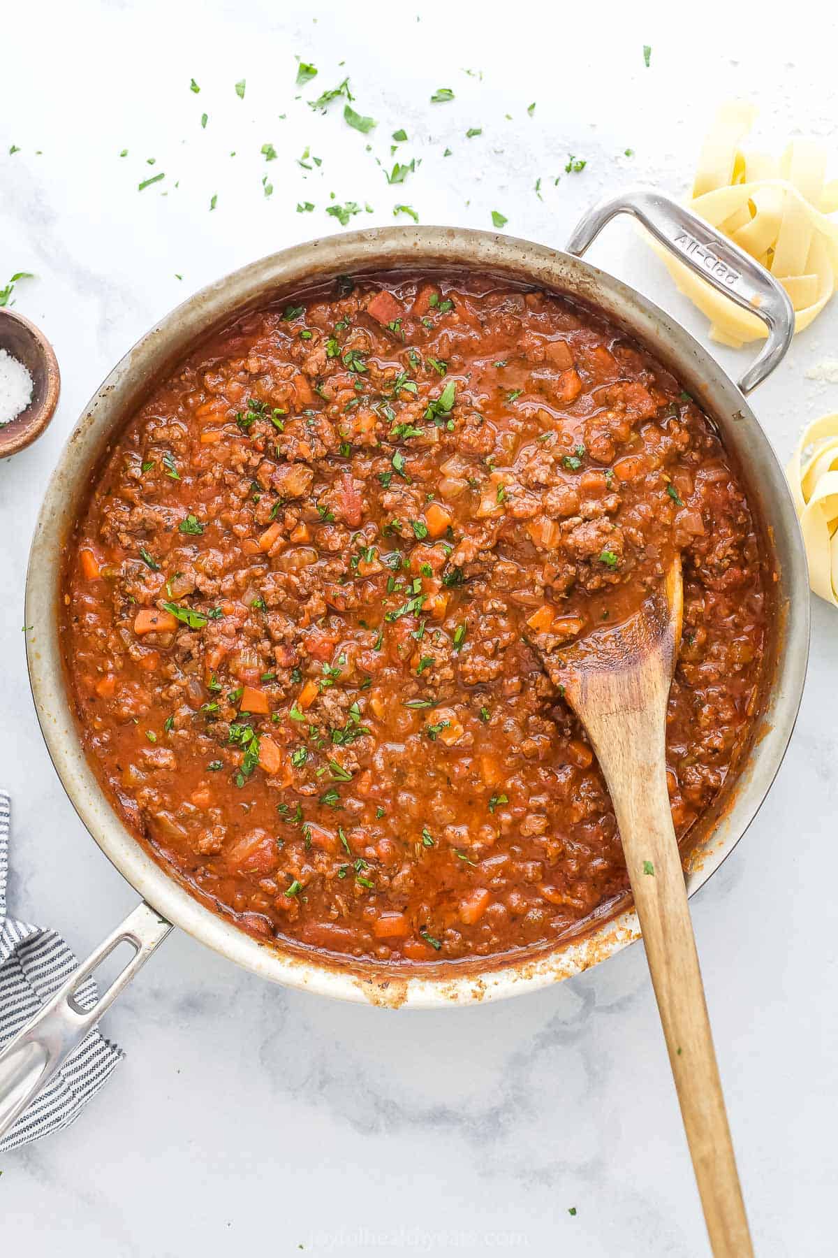 Pasta sauce simmering in pot made with beef, vegetables, and tomato sauce