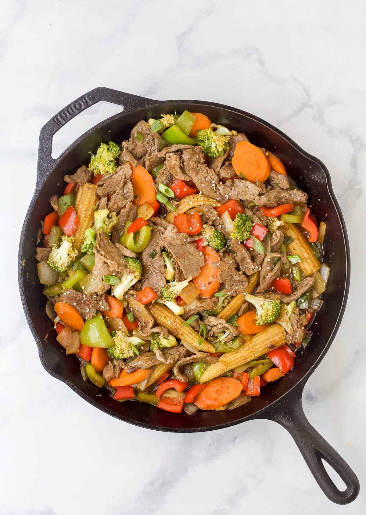 beef stir fry in a cast iron skillet