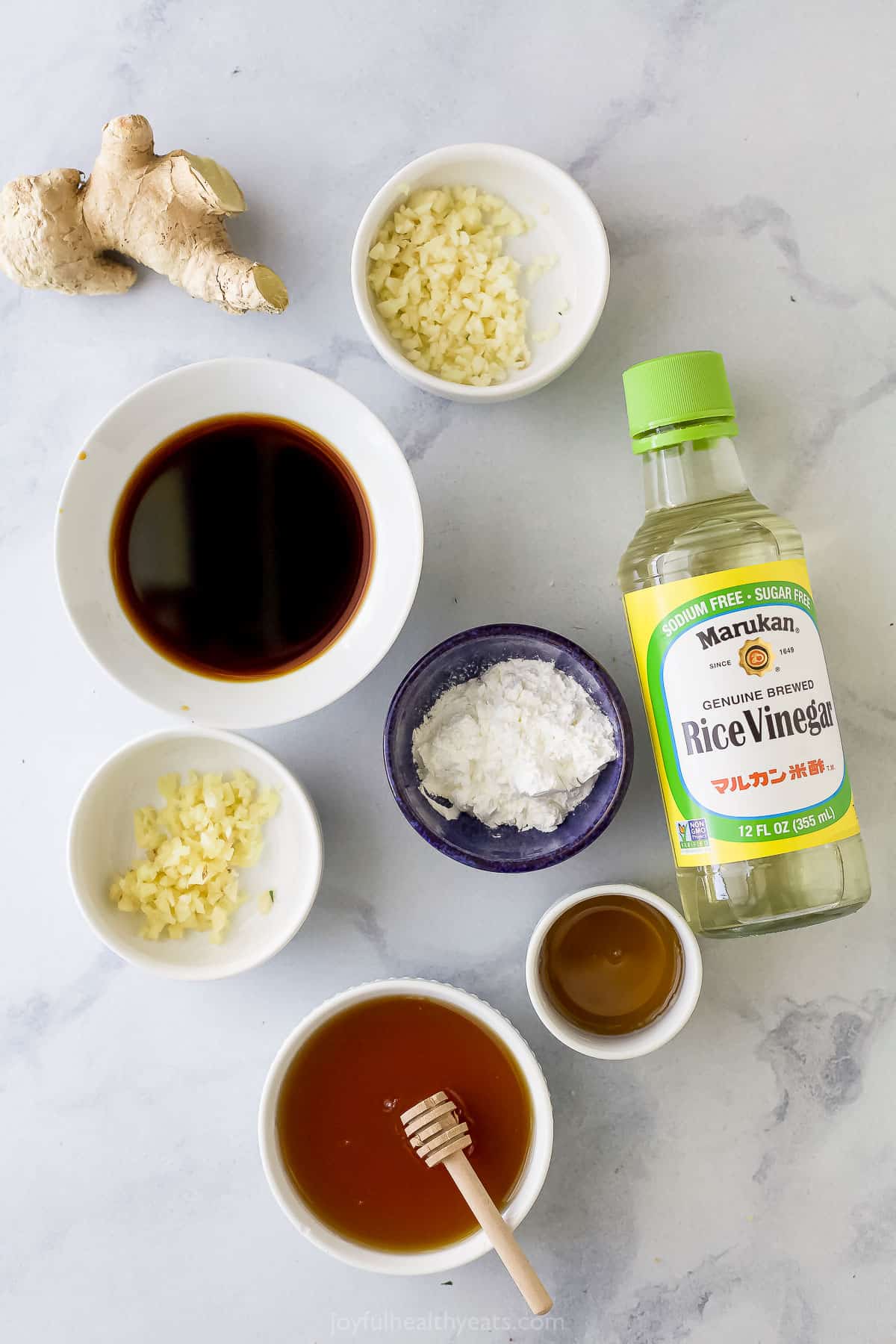 Tamari sauce, fresh ginger, rice wine vinegar and the rest of the teriyaki ingredients on a countertop
