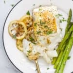 plated seared sea bass with asparagus on the side