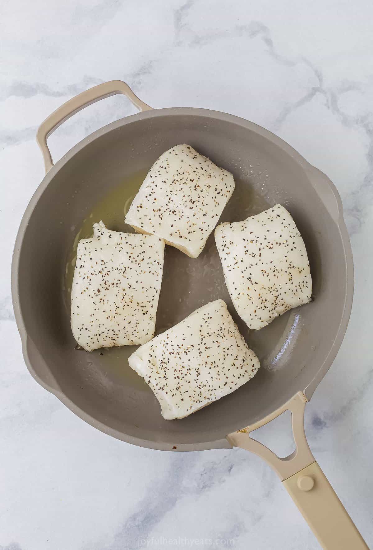 searing sea bass skin side down in a non-stick pan