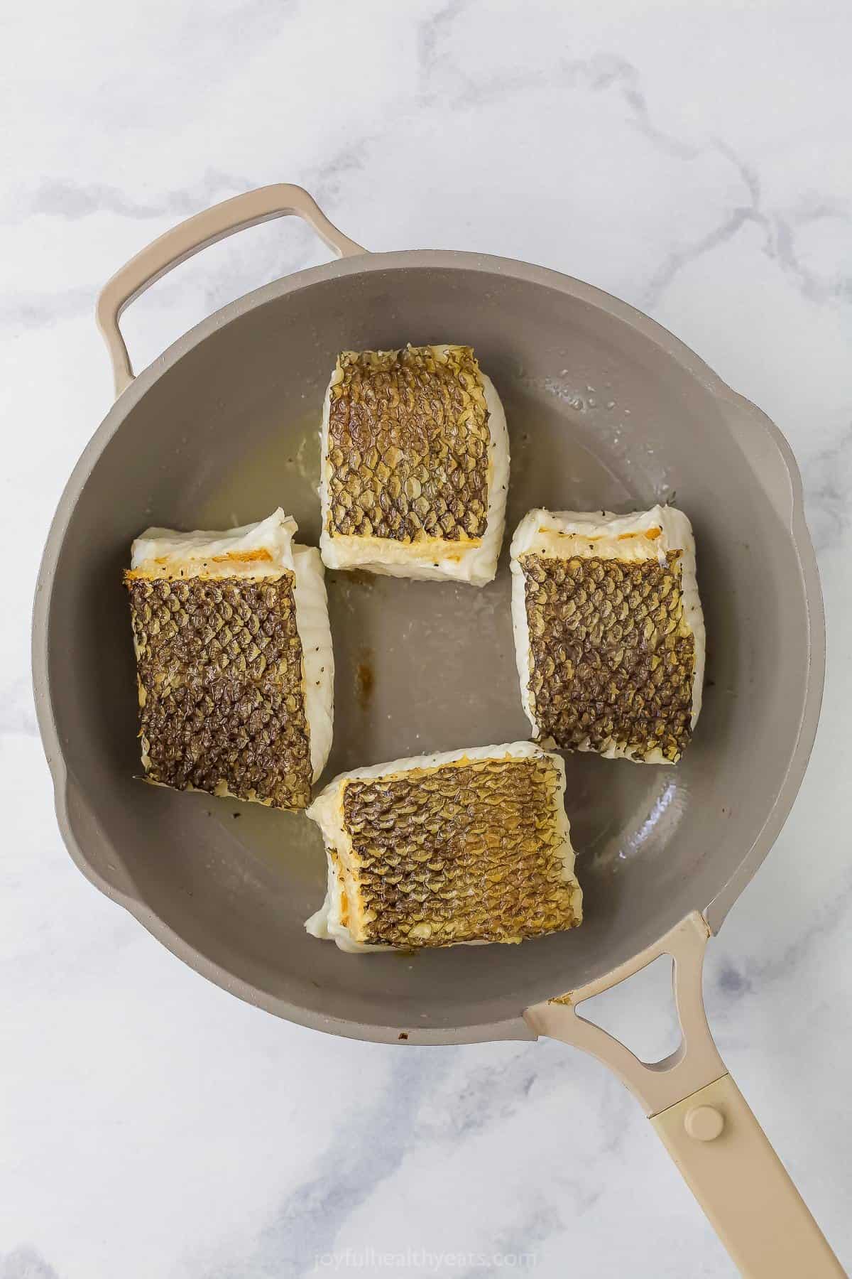 searing sea bass flesh side down in a non-stick pan