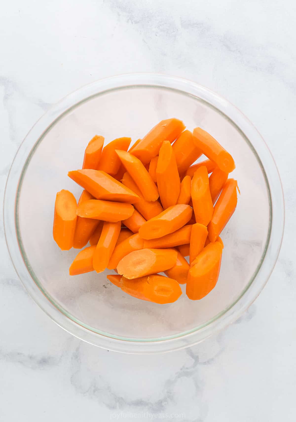 a bowl of cut up carrots