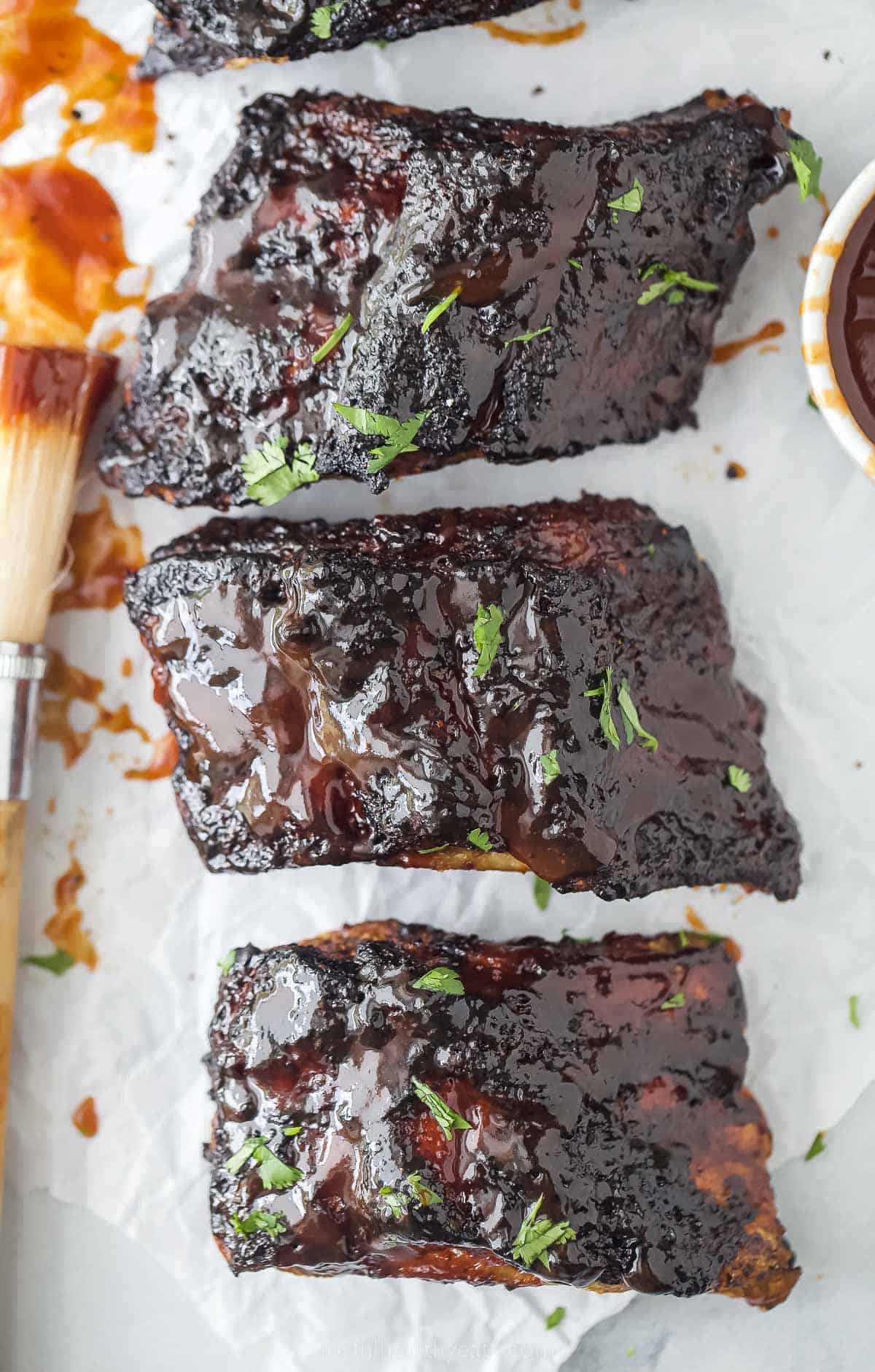 a close up of cooked BBQ ribs