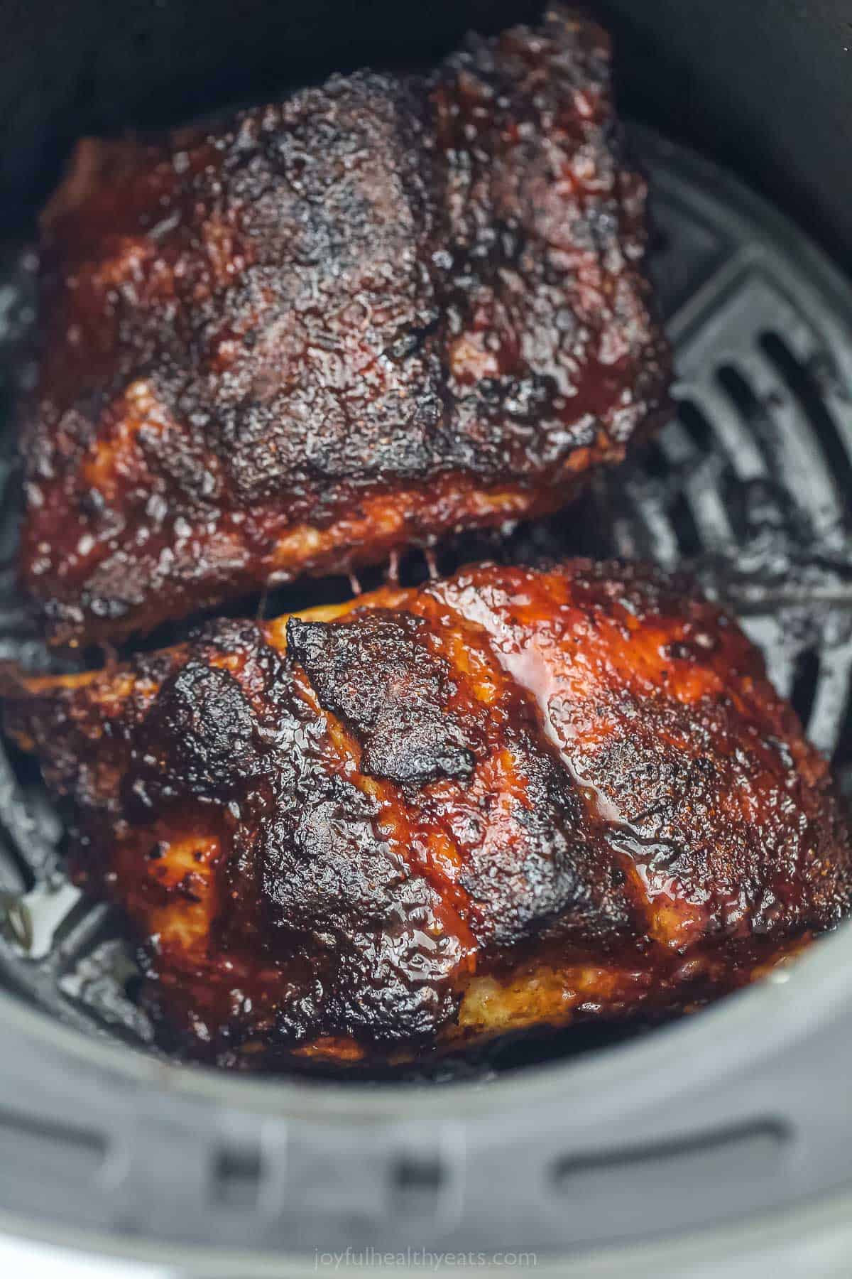 a close up of cooked BBQ ribs