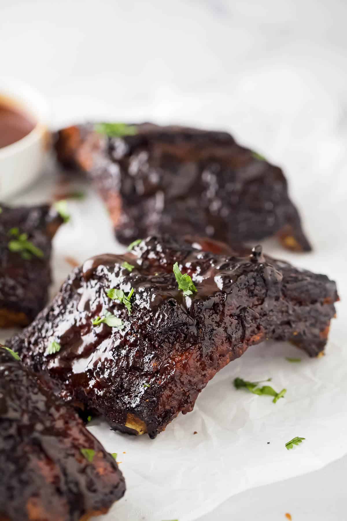 a close up of cooked BBQ ribs