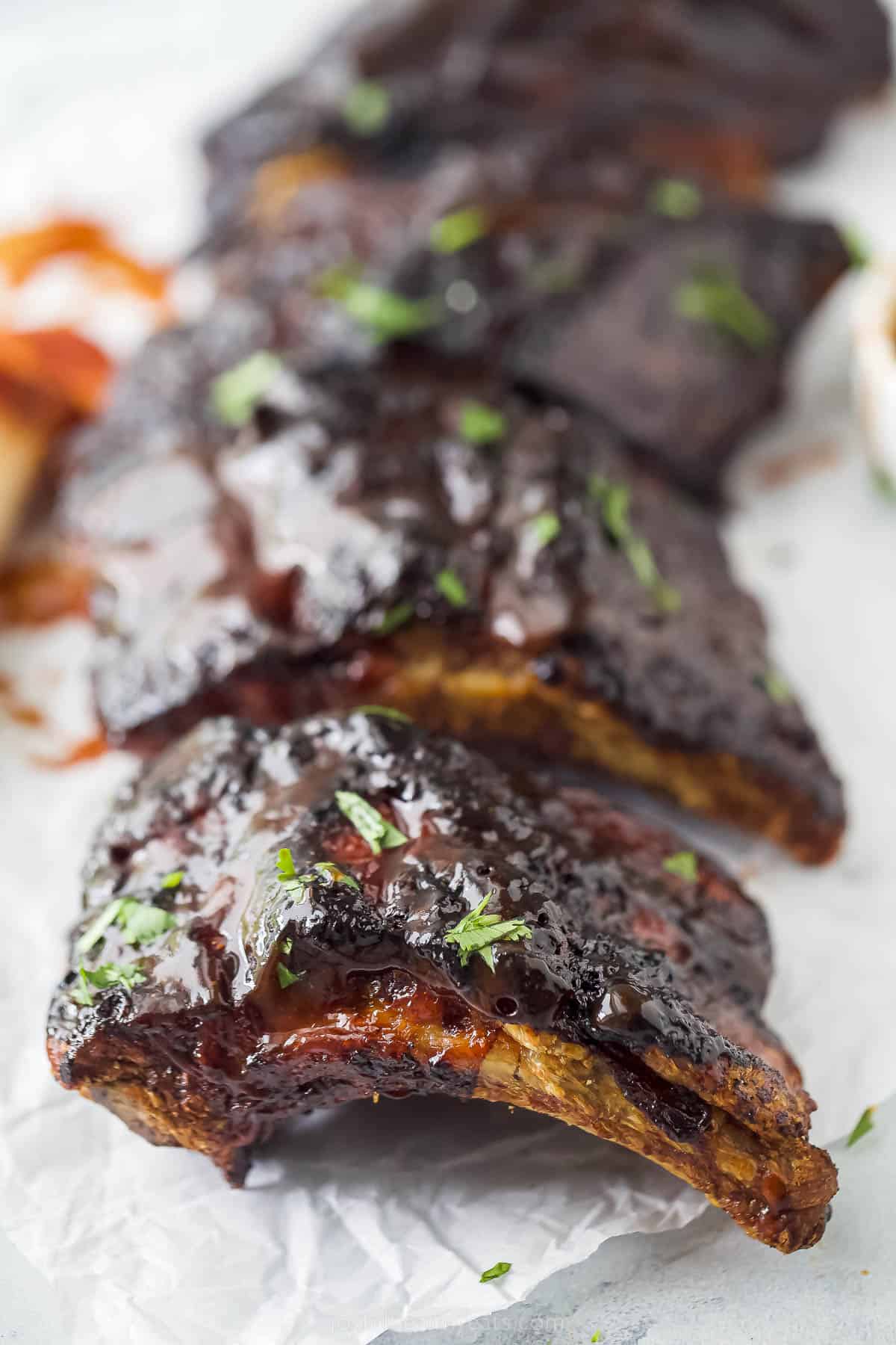 a close up of cooked BBQ ribs