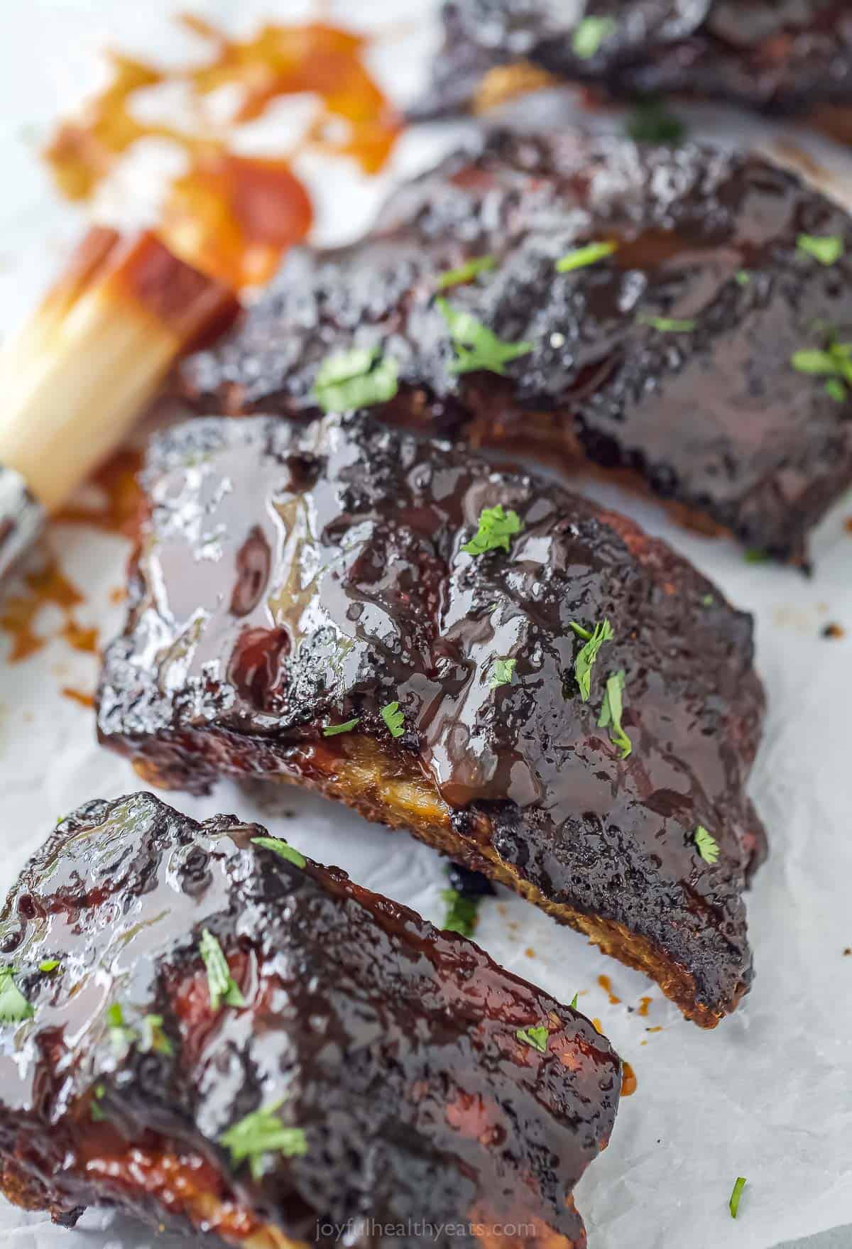 a close up of cooked BBQ ribs