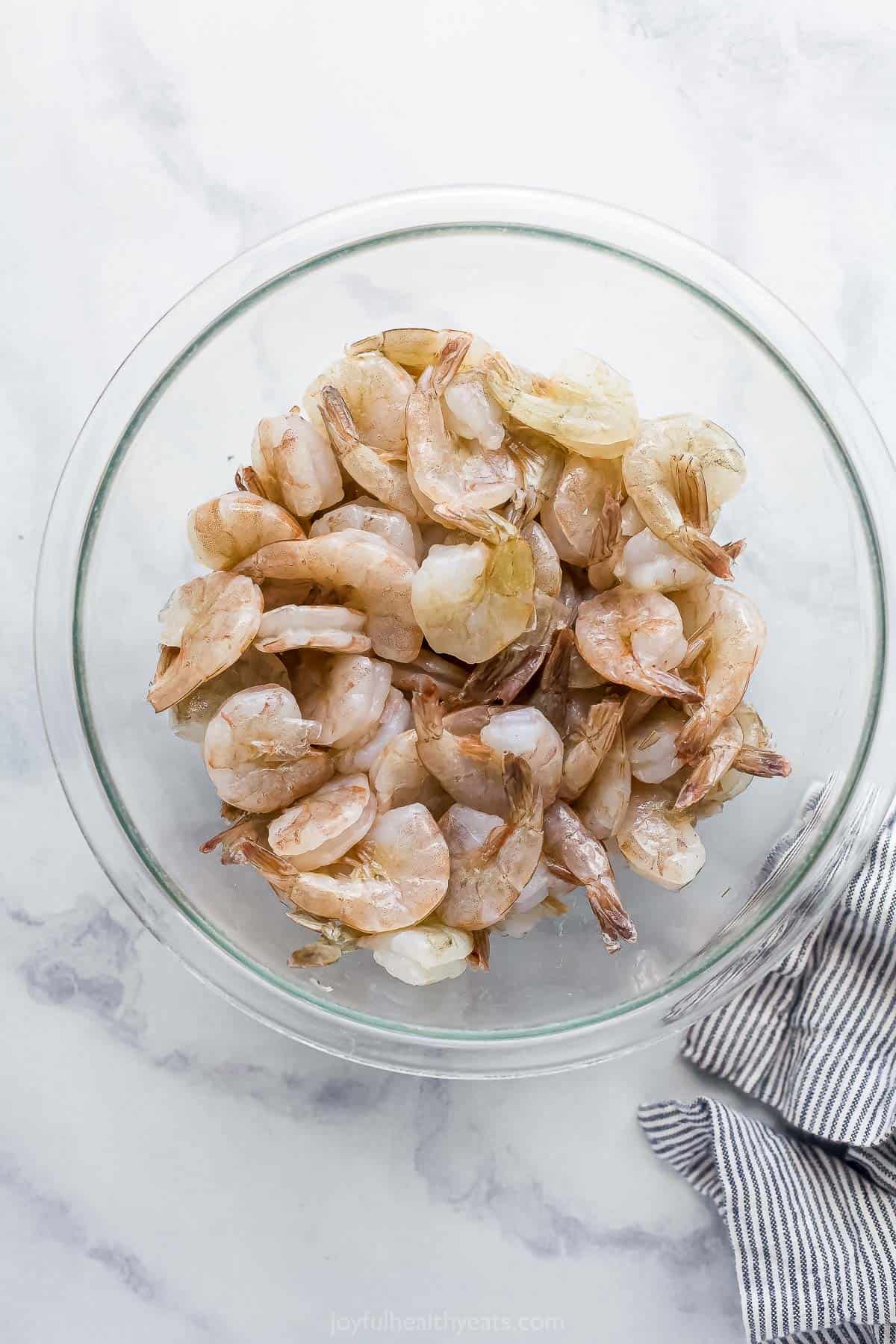 a bowl of raw shrimp