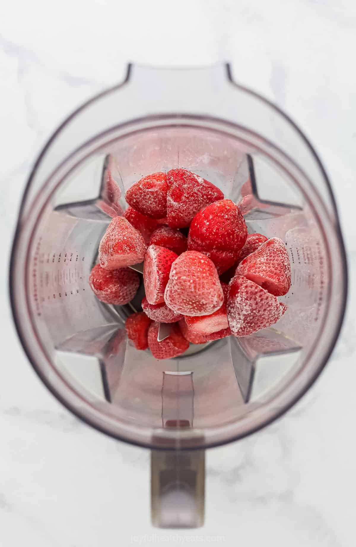 Frozen strawberries in a blender
