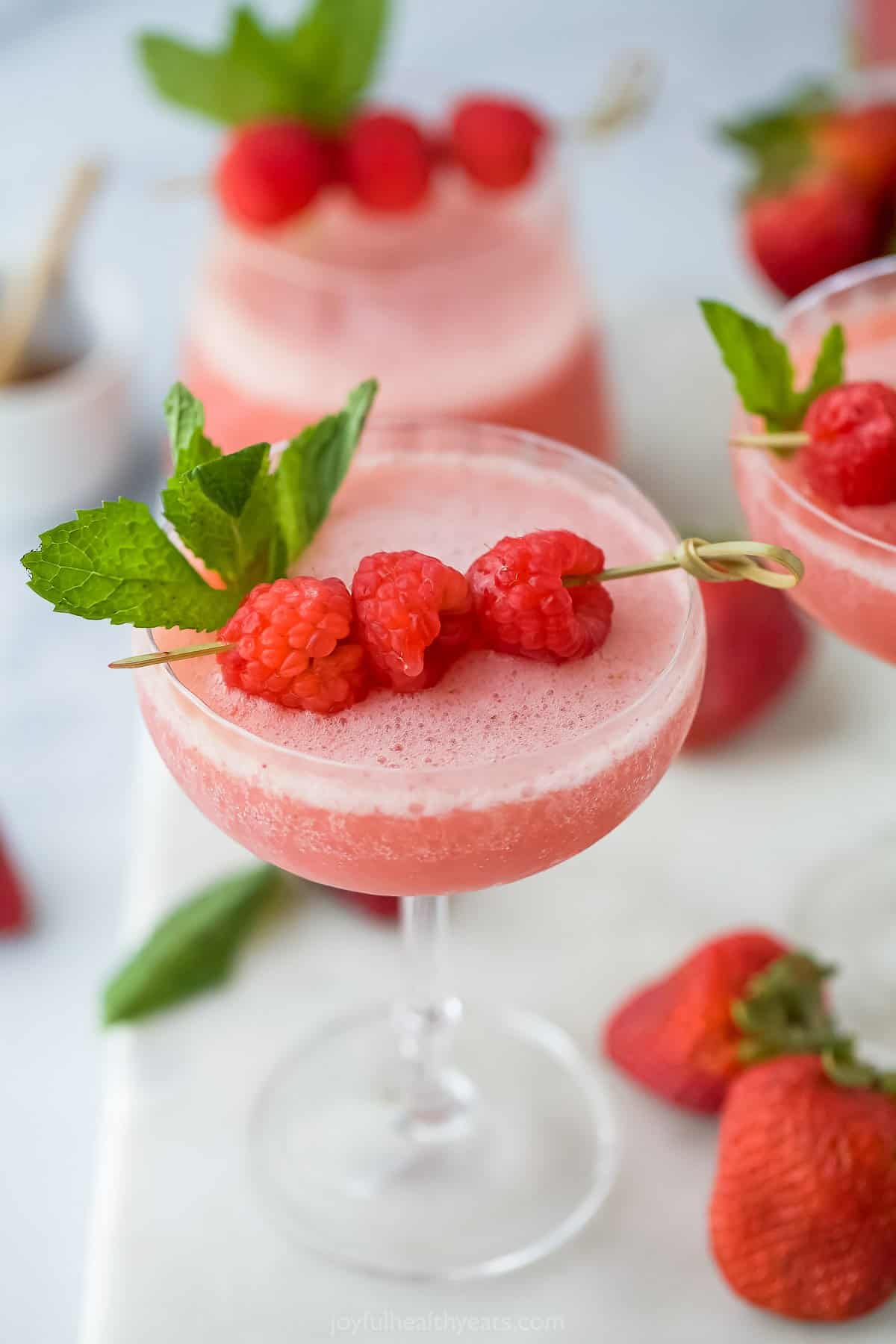 frozen wine with raspberry and mint garnish
