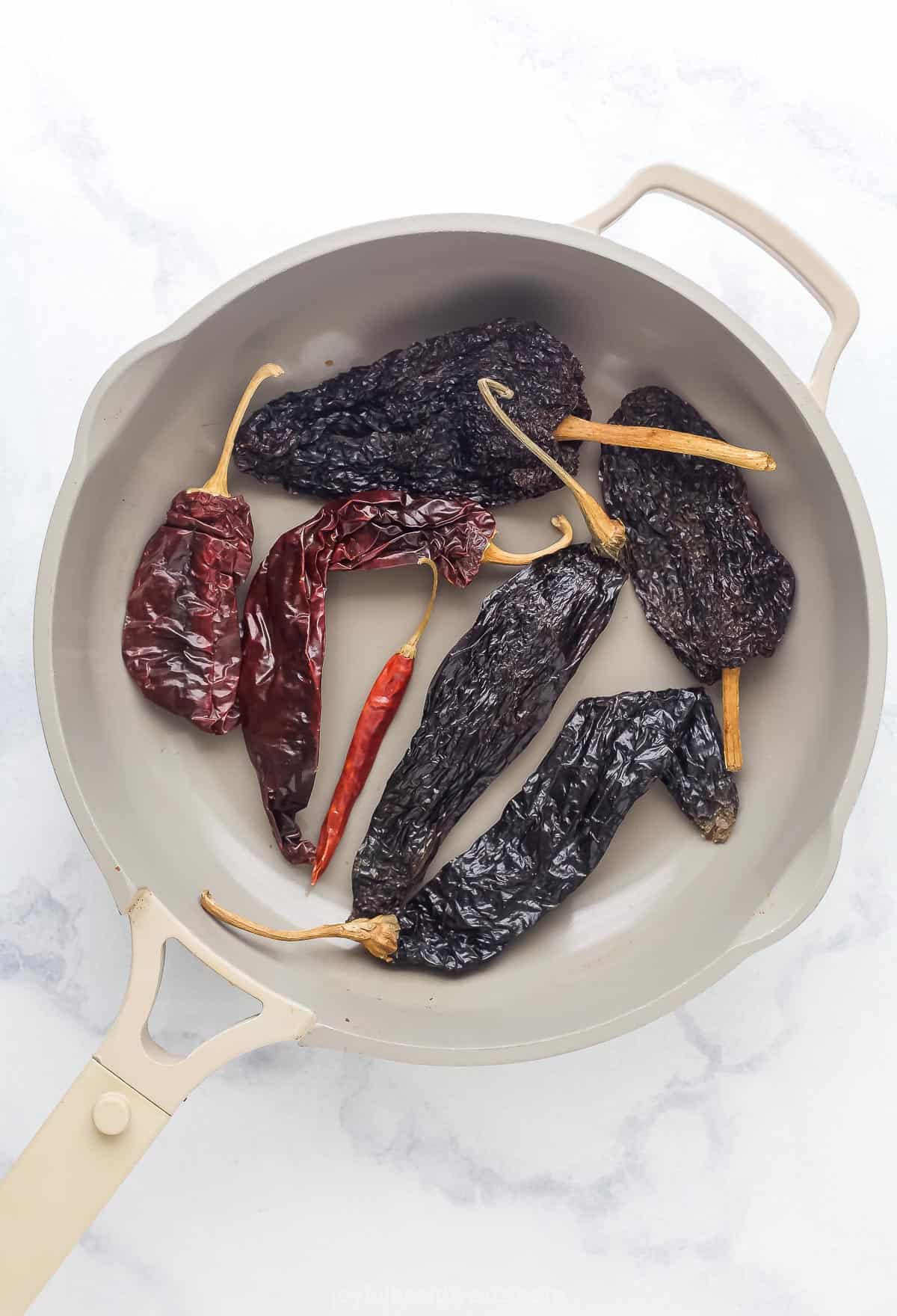 dried chilis in a saute pan