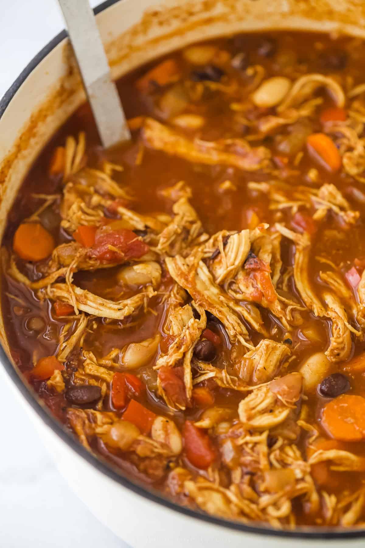 Close up of chicken chili with beans and vegetables.