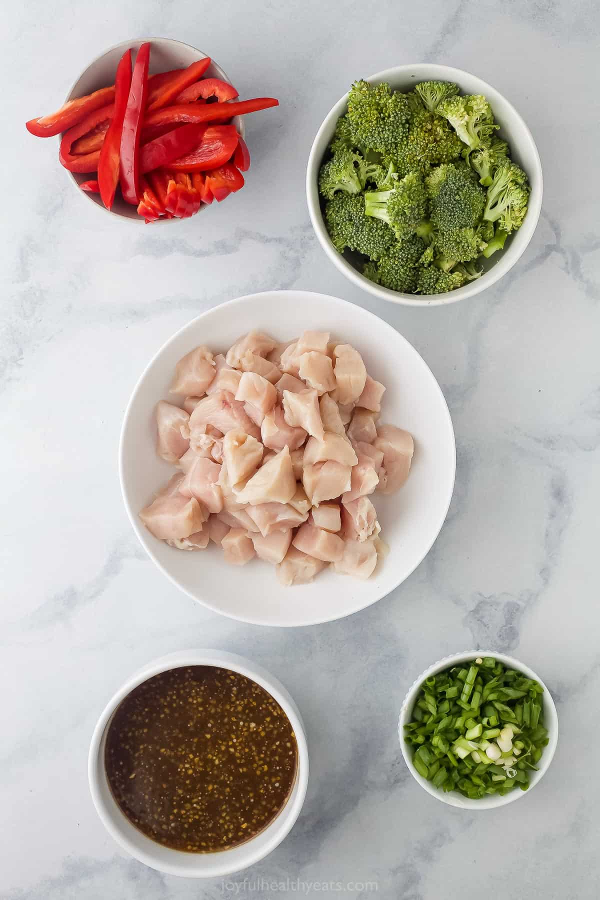 prep bowls with chicken, vegetables, and a dark brown sauce