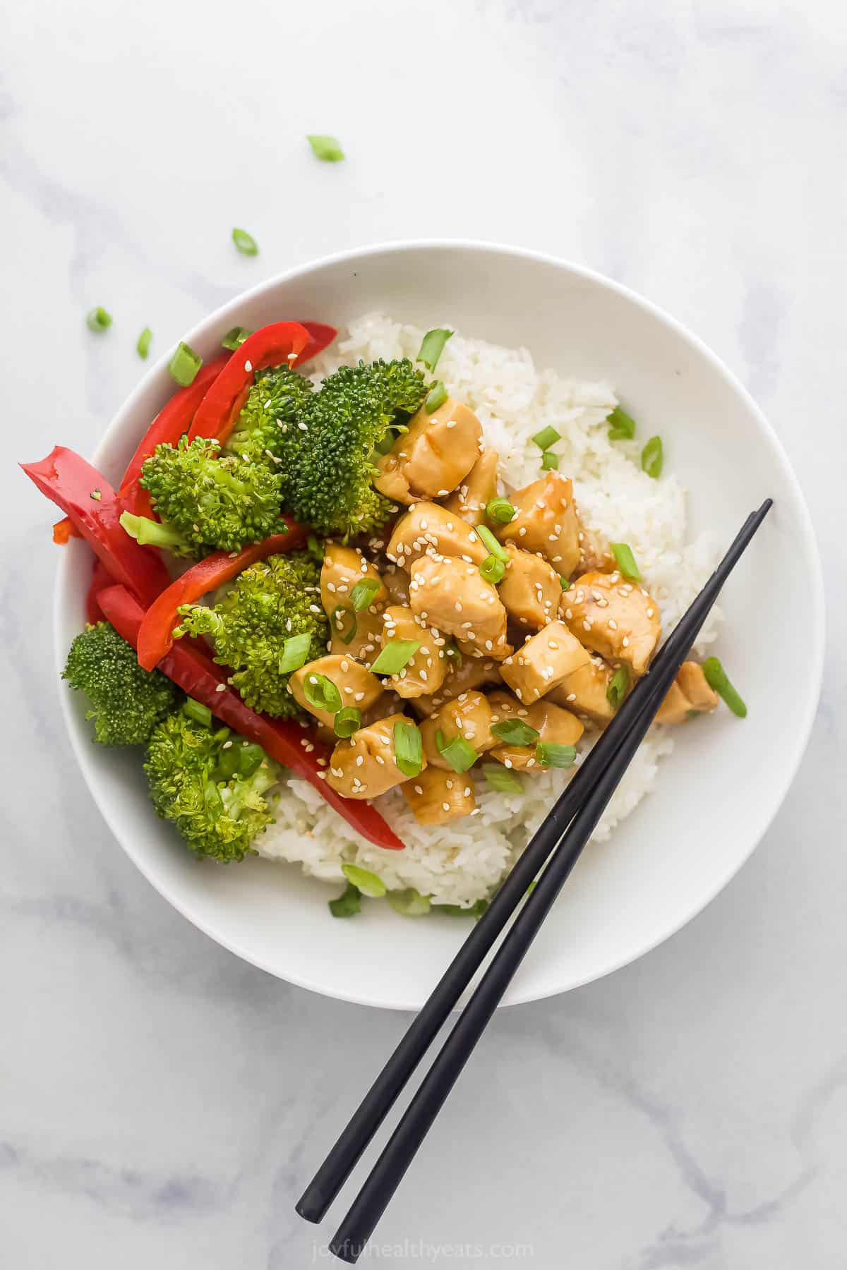 teriyaki chicken bowl with broccoli and red peppers