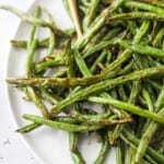 fried green beans on a white plate