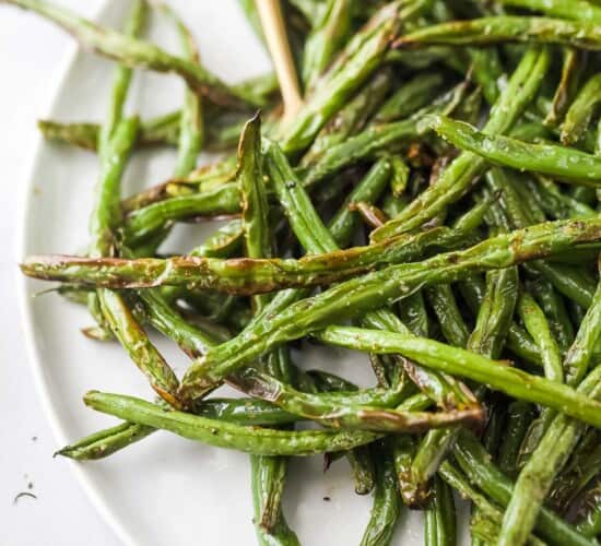 fried green beans on a white plate