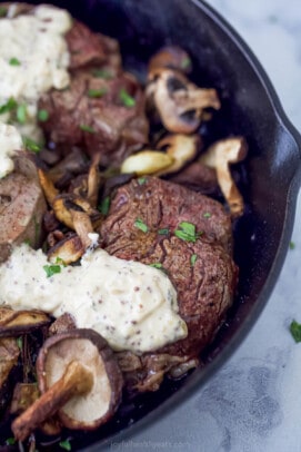 five filet mignon steaks with mushrooms and mustard sauce