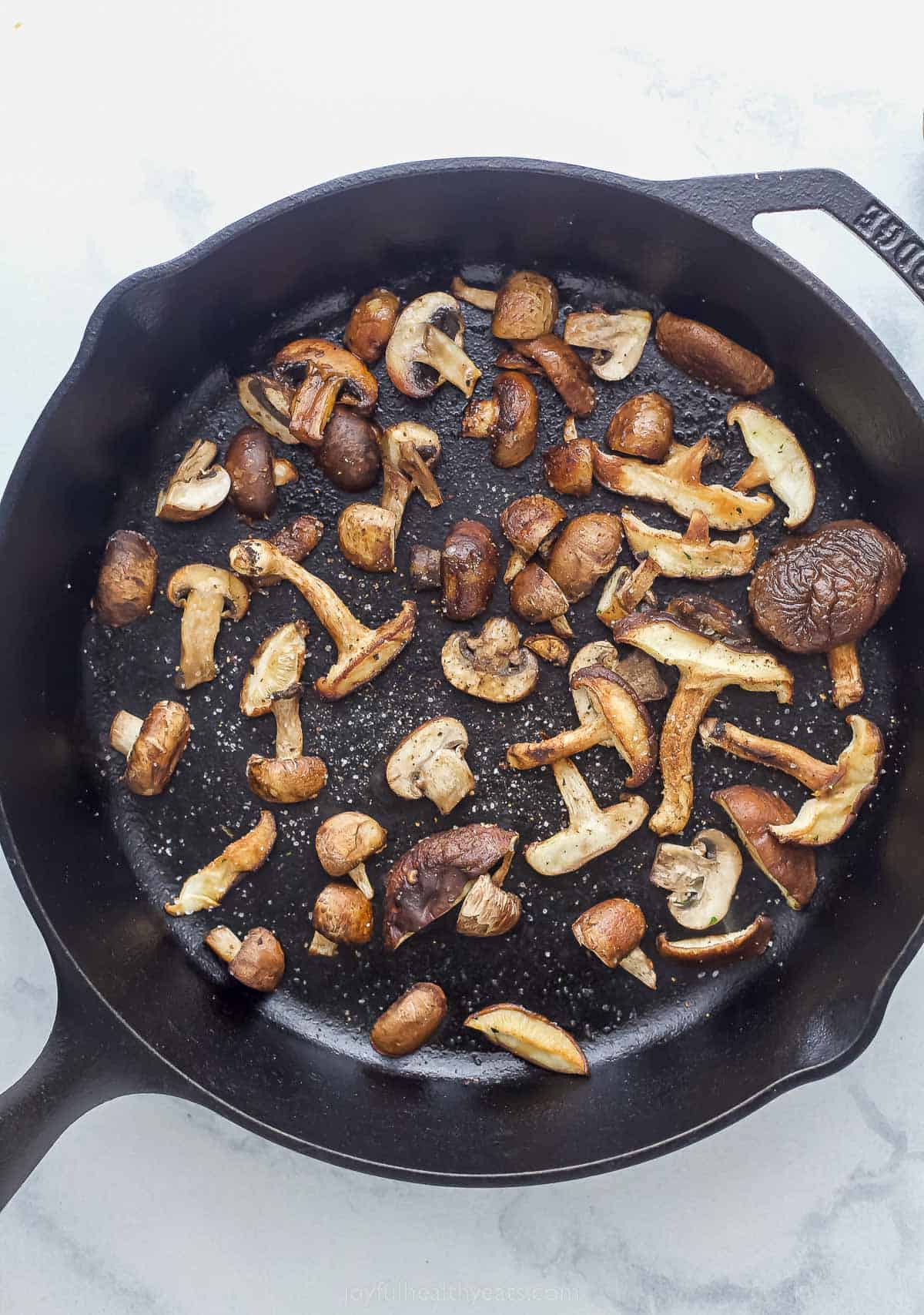 cast iron skillet with mushrooms