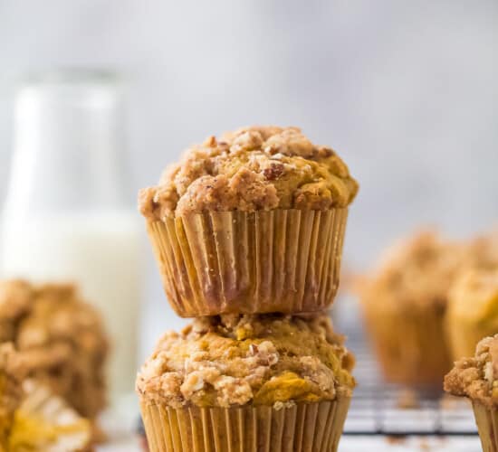 two pumpkin muffins stacked on top of each other